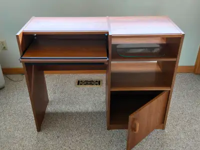 Wooden desk with 2 shelves, 1 cupboard with door and pull out keyboard shelf. Great condition. Askin...