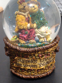 Sisters lives are woven together musical water globe.