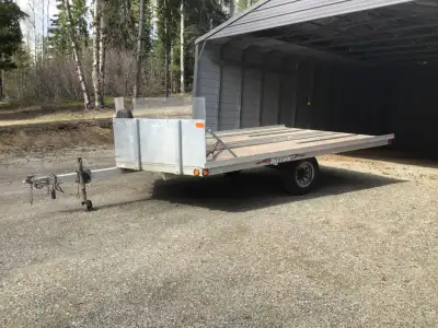 Two place trailer in awesome shape. 3500 lb torsion axle 2" ball hitch 14’x 8’ wooden deck 14” tires...