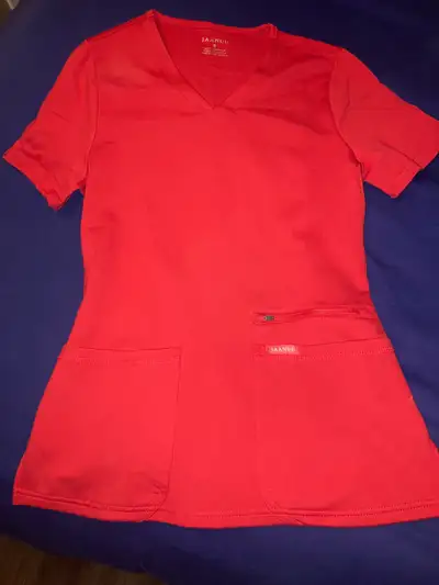 Brand new brilliant red Jaanuu scrub set. Soft and stretchy, but slim-fitted. Top size small, bottom...