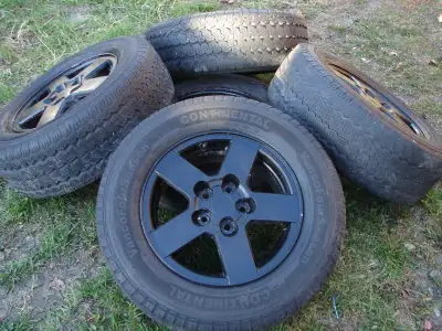 180.00....Set of 4 Chevy Logo truck alum. rims with tires...NOTE: these are older rims left in my si...