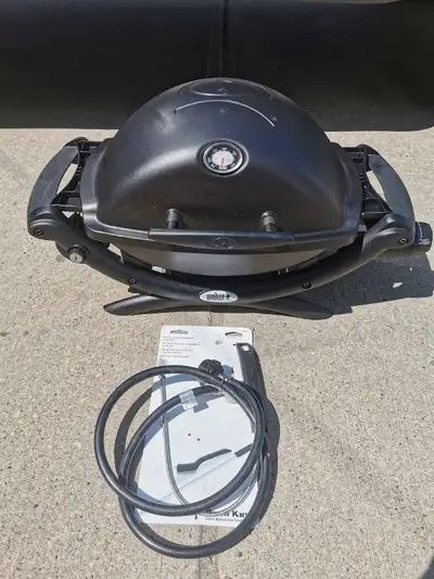 Excellent working condition Black Weber Q1200 portable BBQ with side shelves. Has been cleaned very...