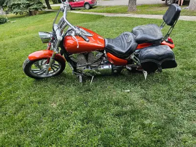 This is a 2006 Honda VTX 1300, a cruiser motorcycle known for its reliable performance and comfortab...