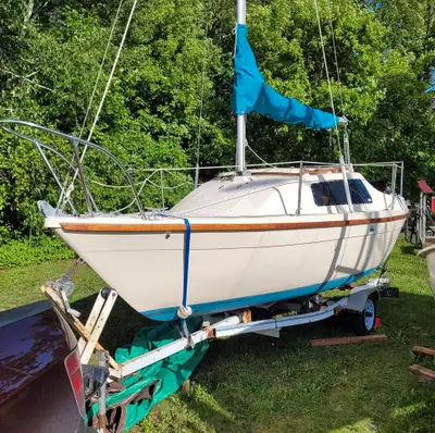 Boat, motor, sails and trailer. Probably a slip at the Pembroke Marina paid for the year. Motor is a...