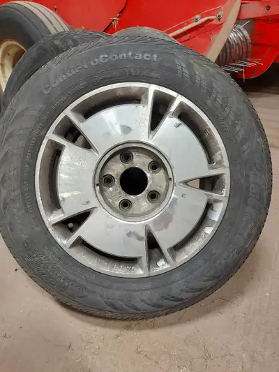 Alloy aluminum Honda rims. Off of a 2009 civic. Conti pro contact continental tires. Over half the l...
