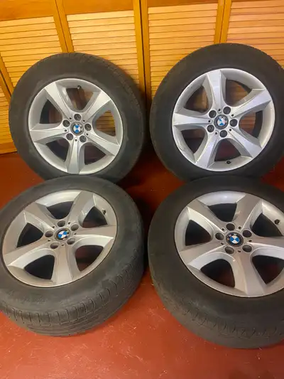 4 used BMW oem rims with used Fuzion all-season tires (bridgestone sub-brand) 255/55 R18. Rims have...
