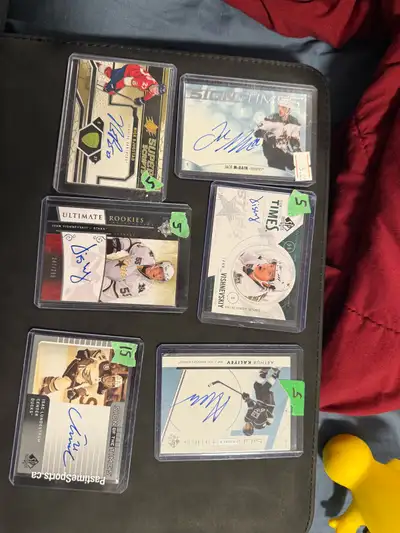 Selling a collection of autographed hockey cards featuring various players and teams. Each card is i...