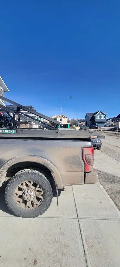 Denali sled deck has sliders and ramp for snowmobiles and in the summer risers that will fit a 2 sea...