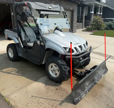2009 Yamaha Rhino 700 sport Comes with front blade and additional wheels with chains on them. Firm o...