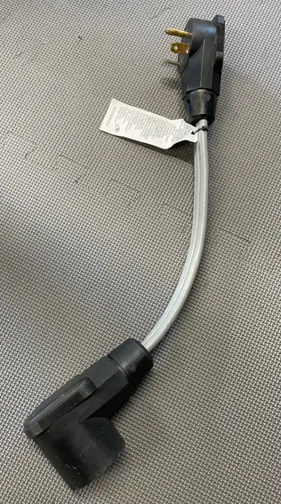 Excellent condition RV polarized power cord adapter, male 30amp to female 50amp Price is FIRM Pick u...