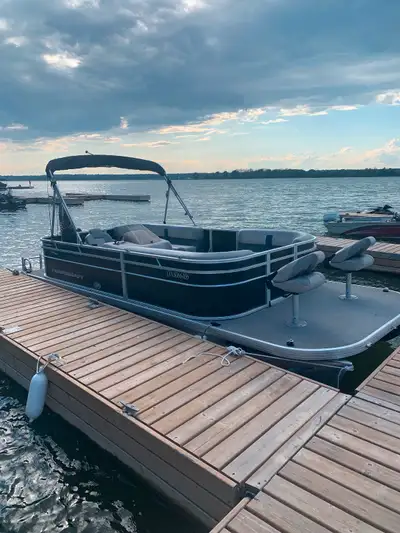 Like new 2022 pontoon and trailer with 2022 60hp mercury 4stroke will sell for 35,000 also will thro...