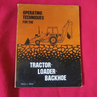 The title is: Operating Techniques for the Tractor Loader Backhoe, written by Gary Ober in 1999. Thi...