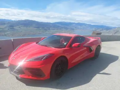 This vibrant Torch Red 2023 Chevrolet Corvette LT1 is a true head-turner with its sleek design and p...