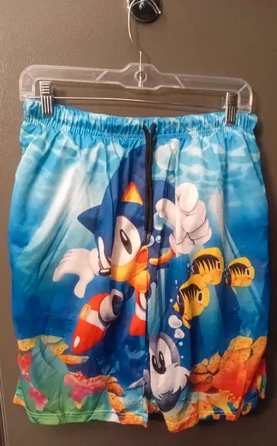 Boy's swim trunks featuring Sonic the Hedgehog underwater. Drawstring waist. Great for swimming, bea...