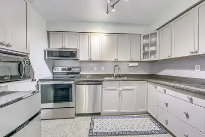 Move-in-ready 2-storey condo featuring an open-concept main floor with hardwood flooring, crown moul...