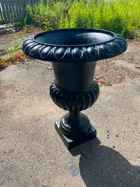 2-30 inch high cast iron urn planters. 240 each