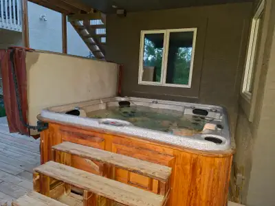 Arctic Spa 94" square 8-10 person hot tub for sale. Strathcona neighborhood in Calgary. Buyer must r...