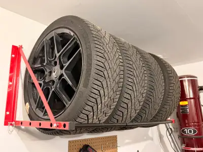 These high-performance 18-inch Continental VikingContact 7 winter tires and gloss black Touren TR79...