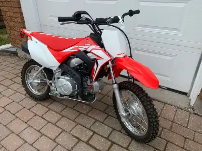 2021 Honda CRF 110, mint condition - barely risen. Custom seat, handle bars and skid plate. Original...