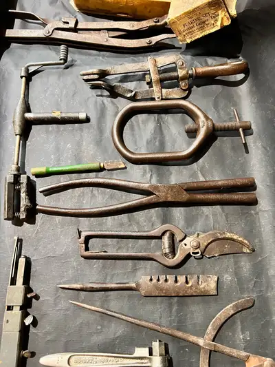 1-Number 79 a flaring set universal copper tube 15$ 2-Overhead valve spring compressor, a tool used...