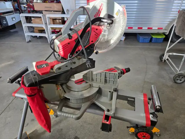 New Condition Milwaukee 12" compound dual beve sliding miter saw in Power Tools in Calgary - Image 5