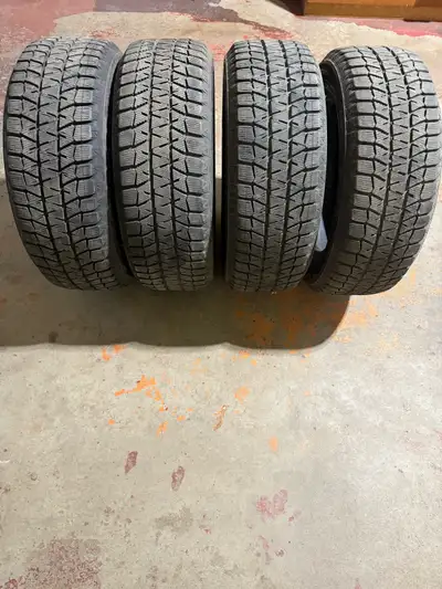 I'm selling a set of four Bridgestone Blizzard winter tires, perfect for providing excellent tractio...
