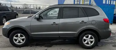 Reliable Hyundai Santa Fe has grey exterior with silver alloy wheels. This SUV is 3.3L AWD model wit...