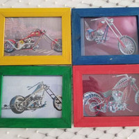 OCC Orange County Choppers bike pictures in wooden frames.