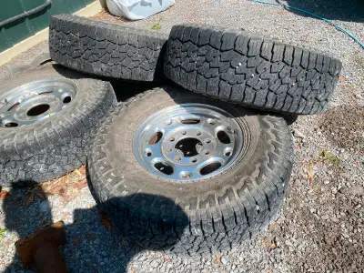 Hi there selling a set of used Chevy or GMC rims and tires !! Good condition Falken Wildpeak All-ter...
