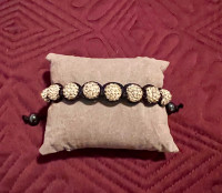 New, crystal gold balls woven into adjustable bracelet