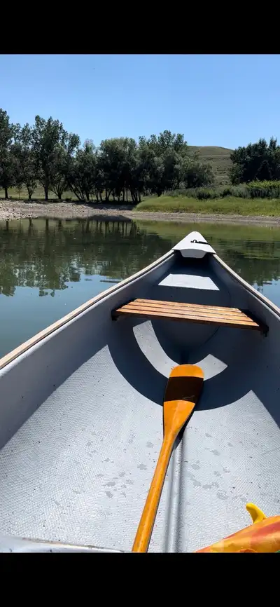 16 foot fibreglass Frontier canoe. Comes with 2 adult life jackets, 1 child life jacket, 2 paddles a...