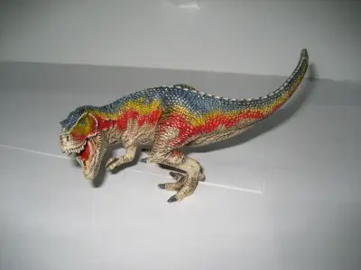 Schleich Tyrannosaurus Rex Figurine Highly detailed and hand painted 3 inches tall, 7 inches wide Ex...