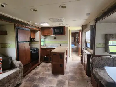 Forest river rockwood ultra lite 2700ss with 2 slide outs a u shaped dinette. King size bed with sto...