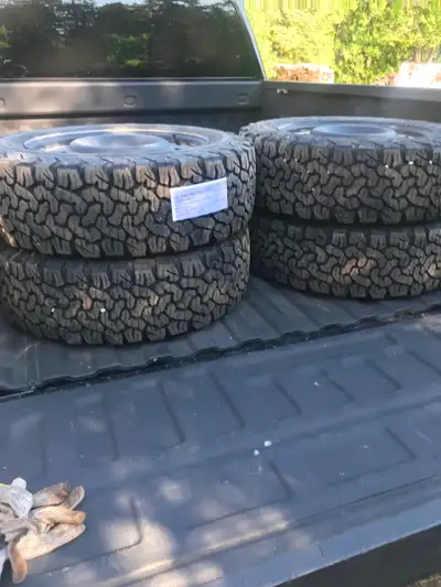 Four All Terran winter tires on rims next to new , off 2024 Ford Bronco .225/65R/17. Email if intere...