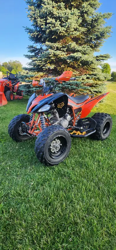 For Sale 2008 250 SE Raptor. New Holeshots on Rear, Aluminum full skid plates, Black/orange nerf bar...