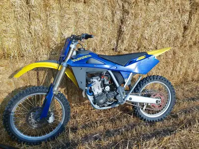 I have a 2005 husky tc250 very solid realiable bike never had any issues. has e start.runs and drive...