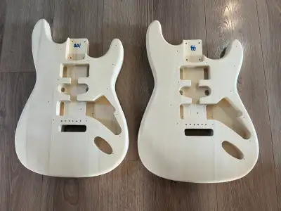 I have Strat style basswood (not plywood) unfinished guitar bodies. I am looking to trade them for e...