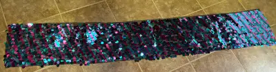 A fancy table runner in almost new condition for sale. Approx 13” x 72” long. Paid over $19.00 Front...