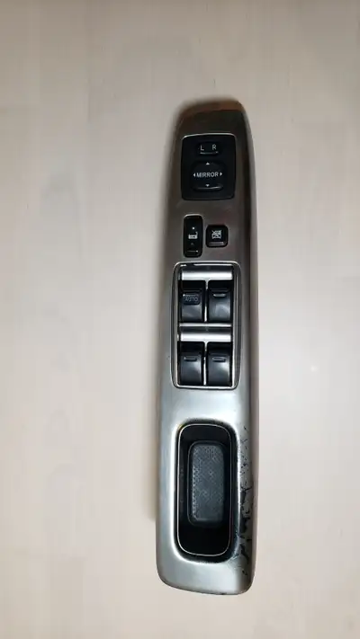 Genuine Toyota driver-side master power window switch assembly. Includes mirror controls. Good used...