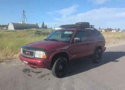 5 speed manual. 4.3L Vortec V6 Lift kit Winter and summer tires/rims Sony Bluetooth stereo Drive it...