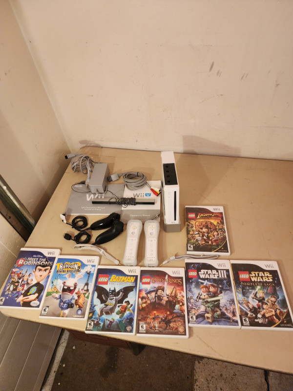 Nintendo Wii with 4 Controllers and 7 Games and Manual in Nintendo Wii in Edmonton