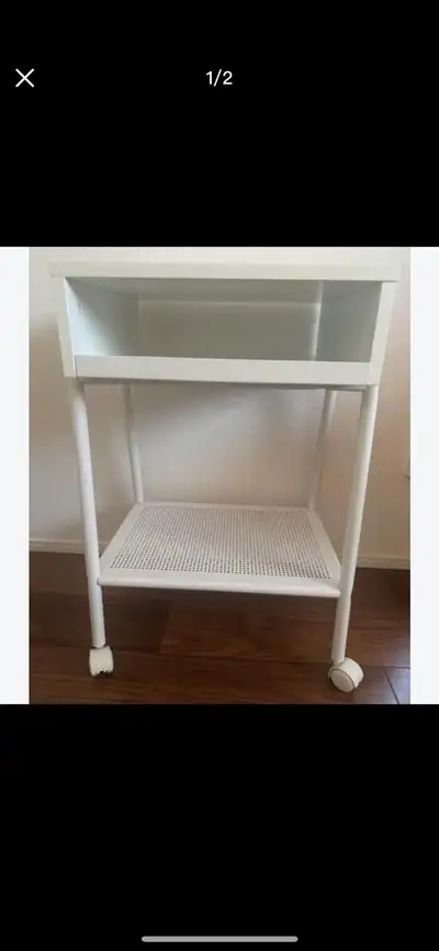 IKEA white rolling side table, View more