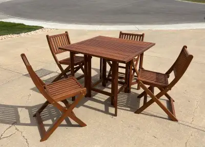 Gently used Teak table and 4 chairs, View more