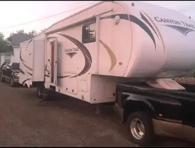 36 foot Couples trailer 3 slides, Queen bed with large closet Washer/dryer hook up. Large Bathroom,...