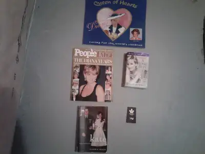 Assorted royal family books and Buckingham palace collector pin. $ 10.00