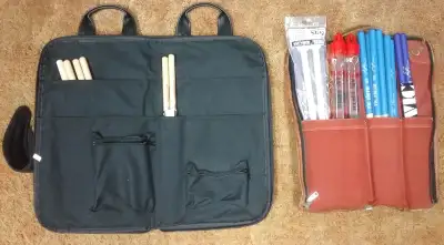 No sticks are included with any bags. Used Vic Firth essentials stick bag. Red. Lightweight, minimal...