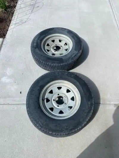 2 trailer tires with rims for sale. Tires are weathering out between tread but rims are good. Size:...