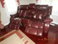 Leather Electric Reclining Sofa and Loveseat.
