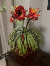 Red glass vase with flowers