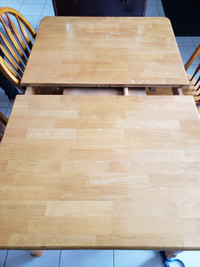 Oak dining table with self storing leaf and 4 chairs